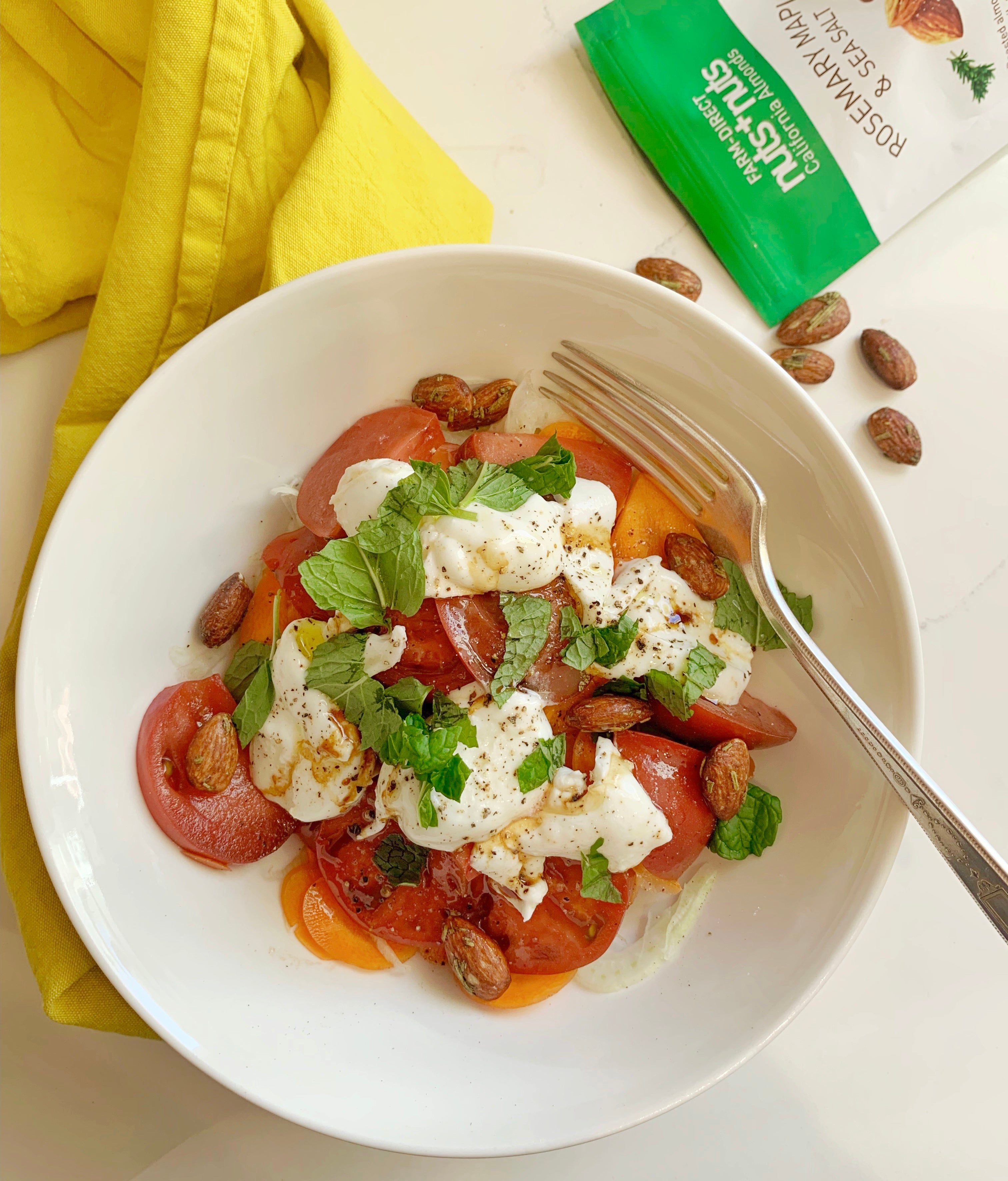 Roasted California Almonds on top of burrata salad