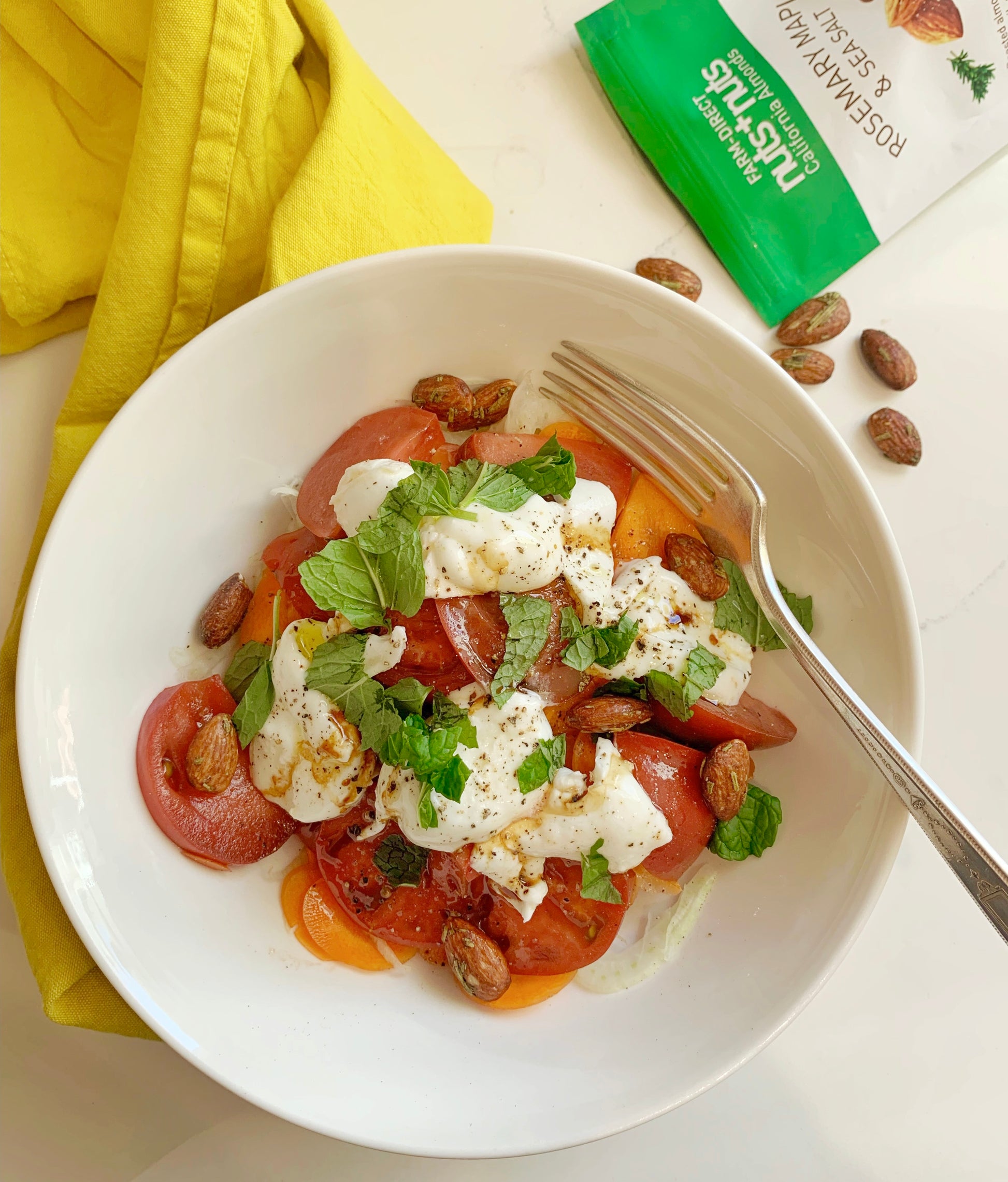 Roasted California Almonds on top of burrata salad